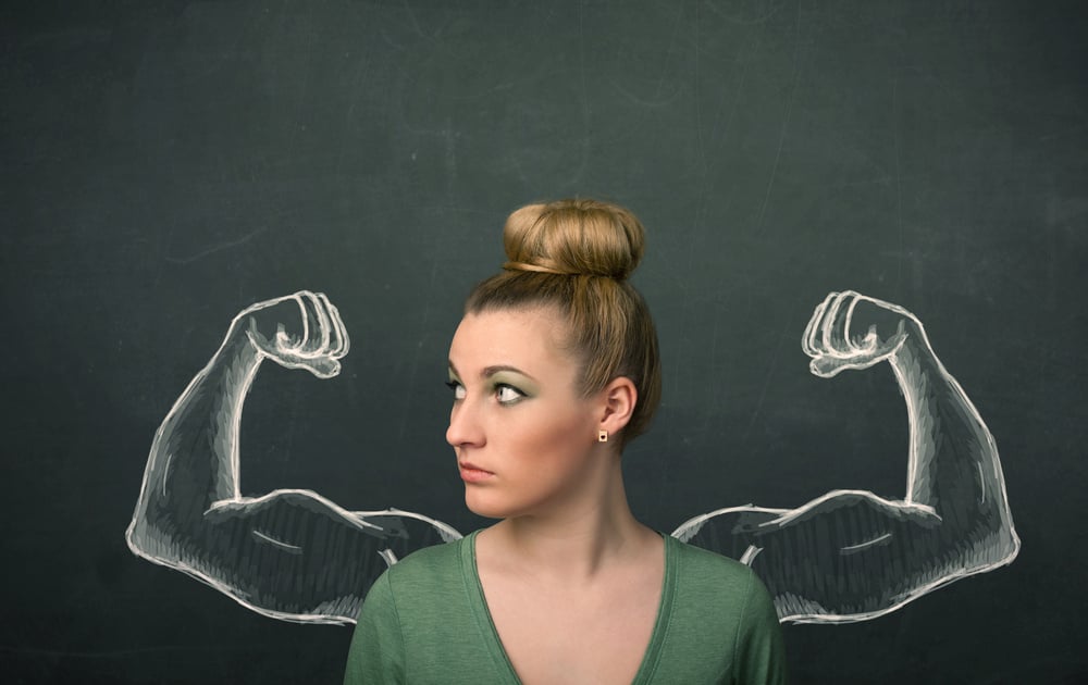 Pretty young woman with sketched strong and muscled arms